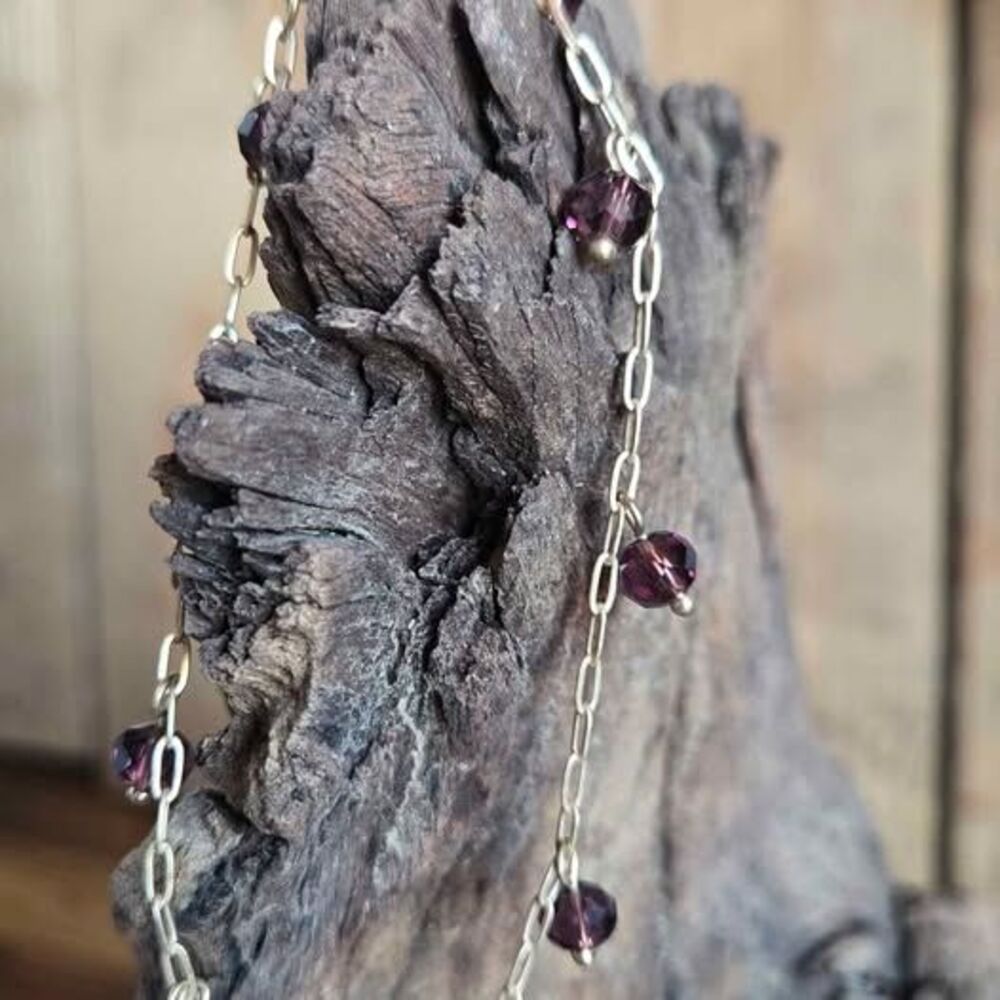 Gold tone purple crystal charm bracelet